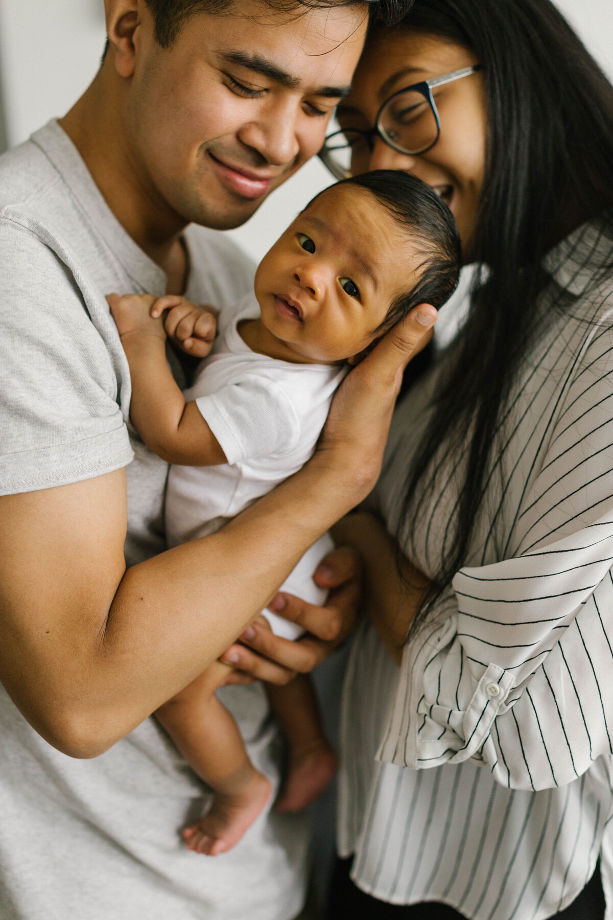 Newborn baby in parents' arms