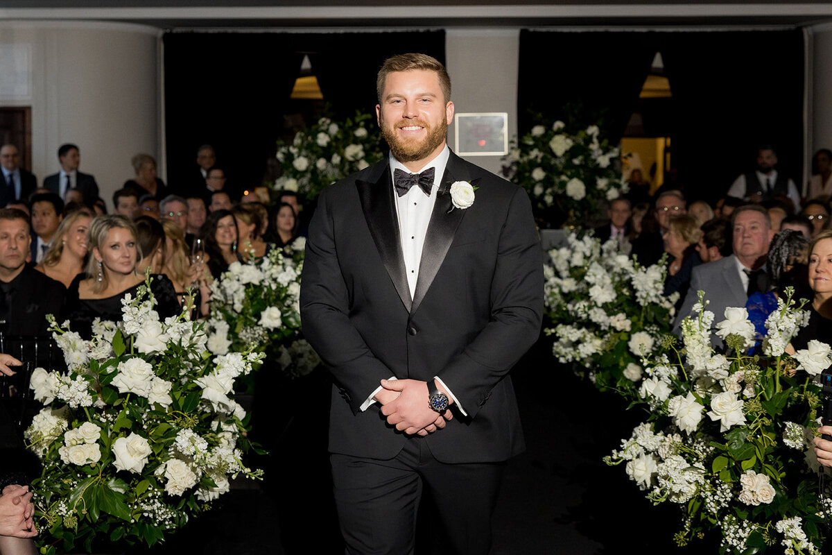 groom-walking-in-ceremony-revel-motor-row-hbicweddings