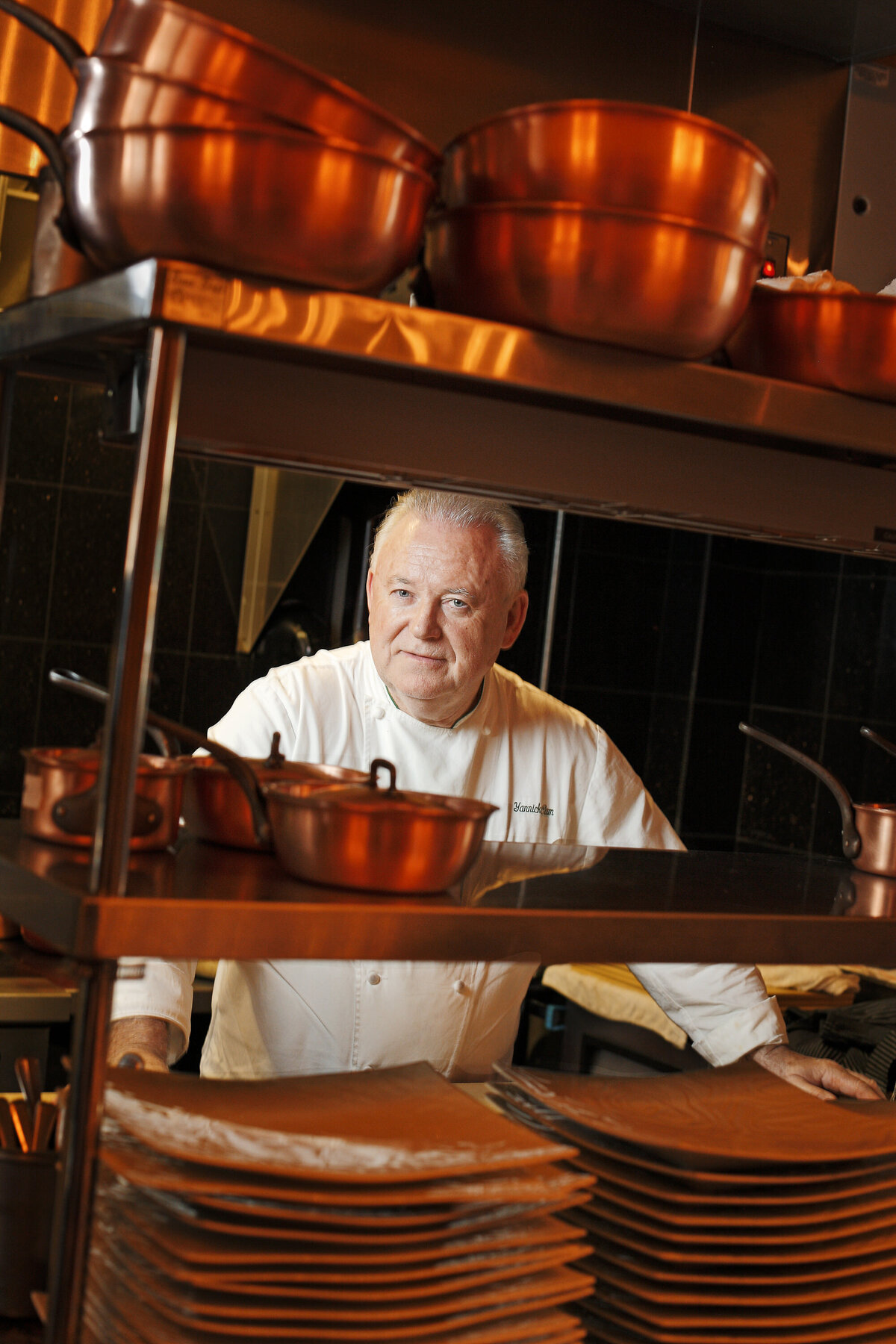 A chef standing in a kitchen