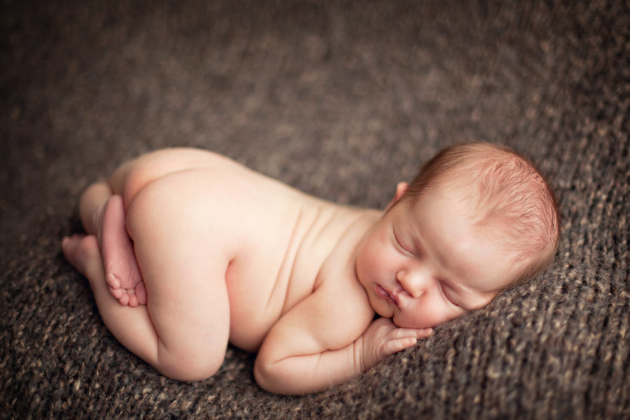 Thousand Oaks couple holding newborn baby during their studio newborn session