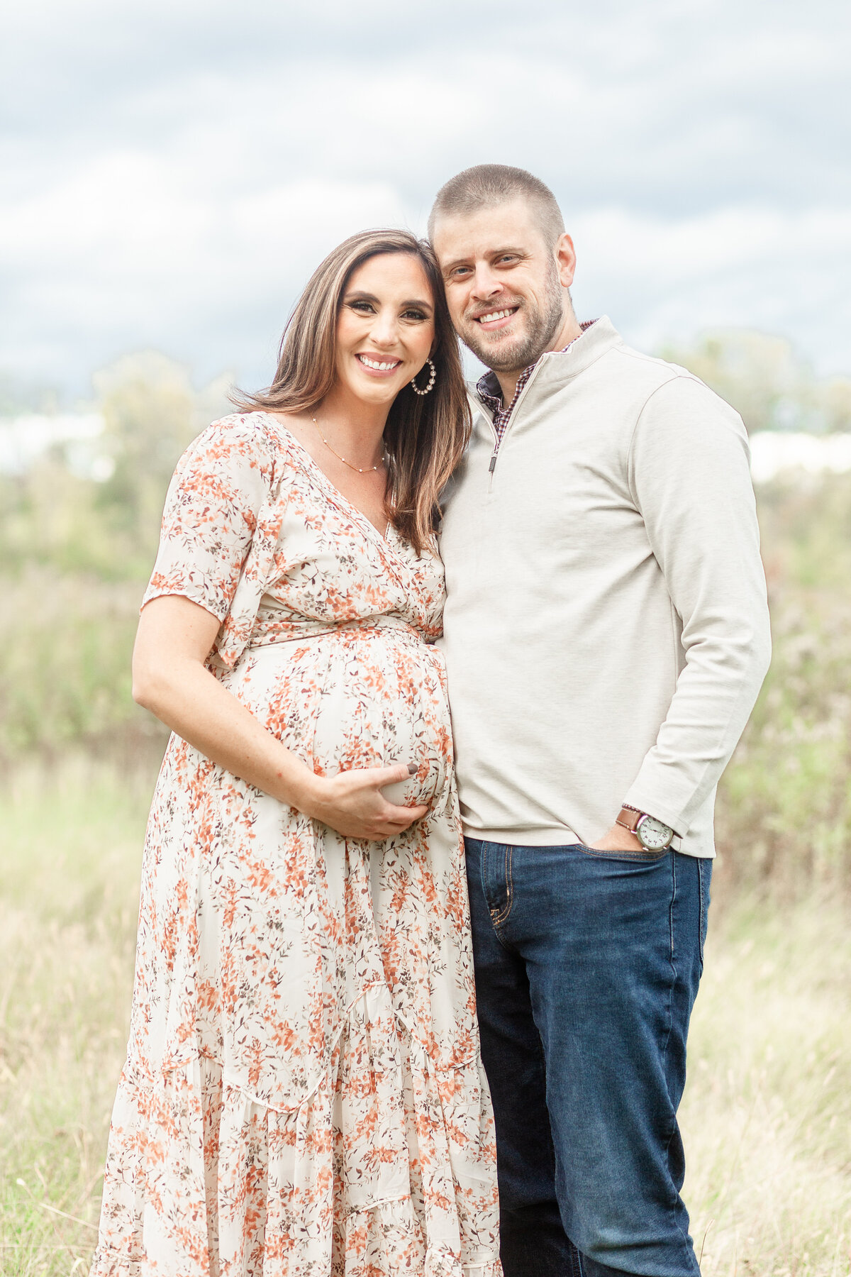 Husband and wife pose for maternity shot taken by Plymouth Michigan Newborn Photographer
