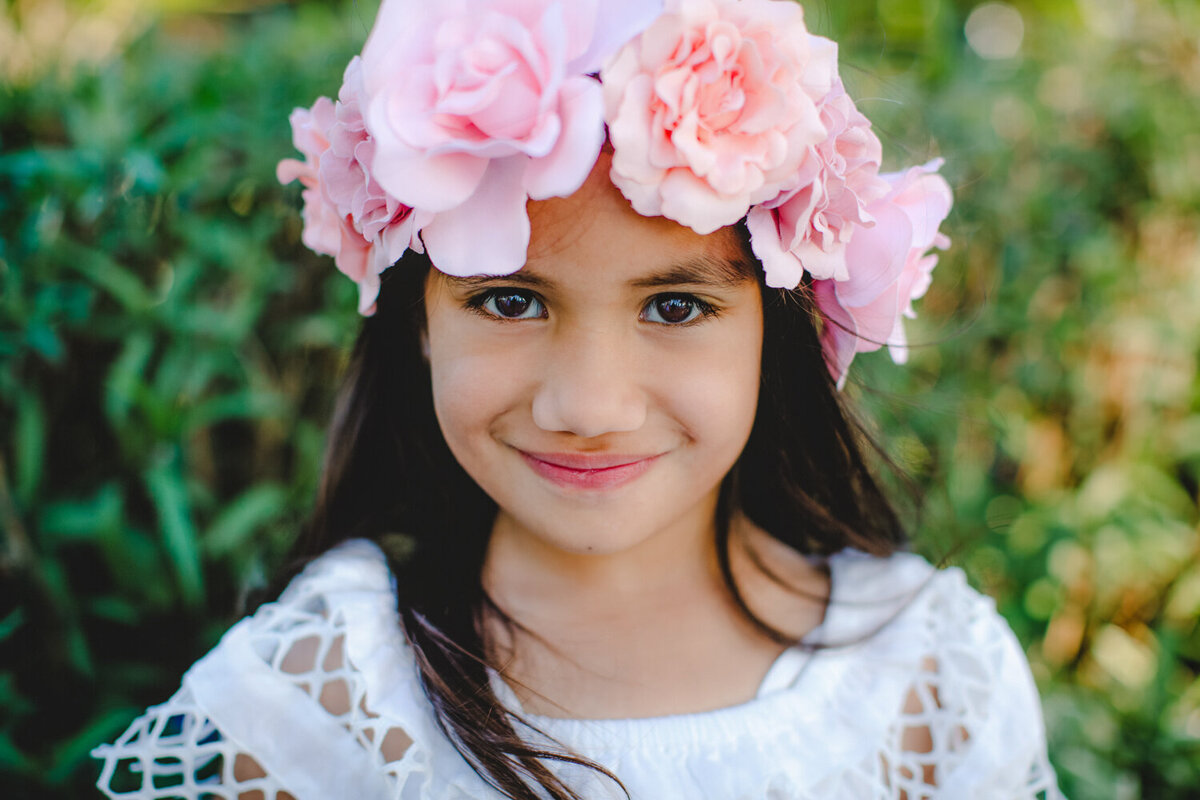 little girl with pink flower crown