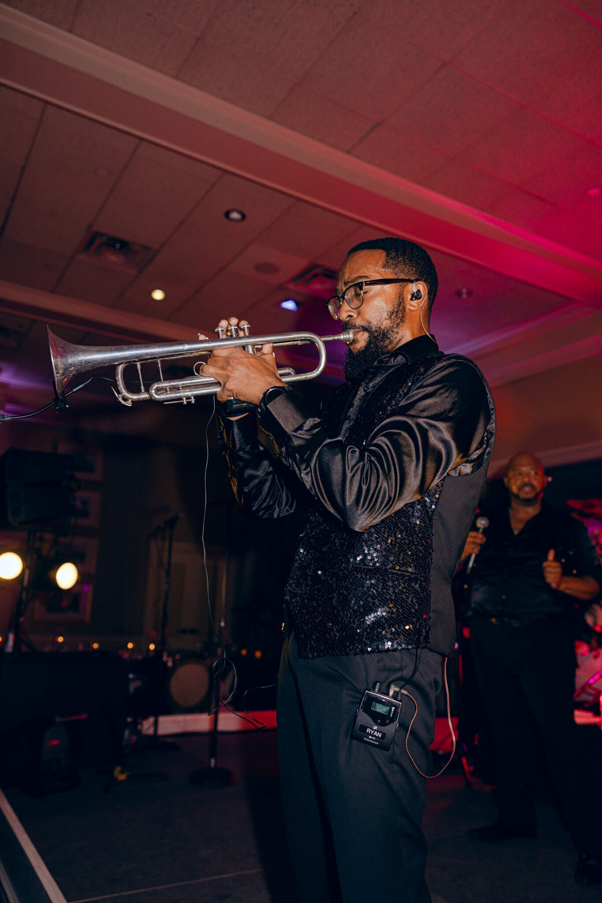 A wedding photo of the band during the wedding reception