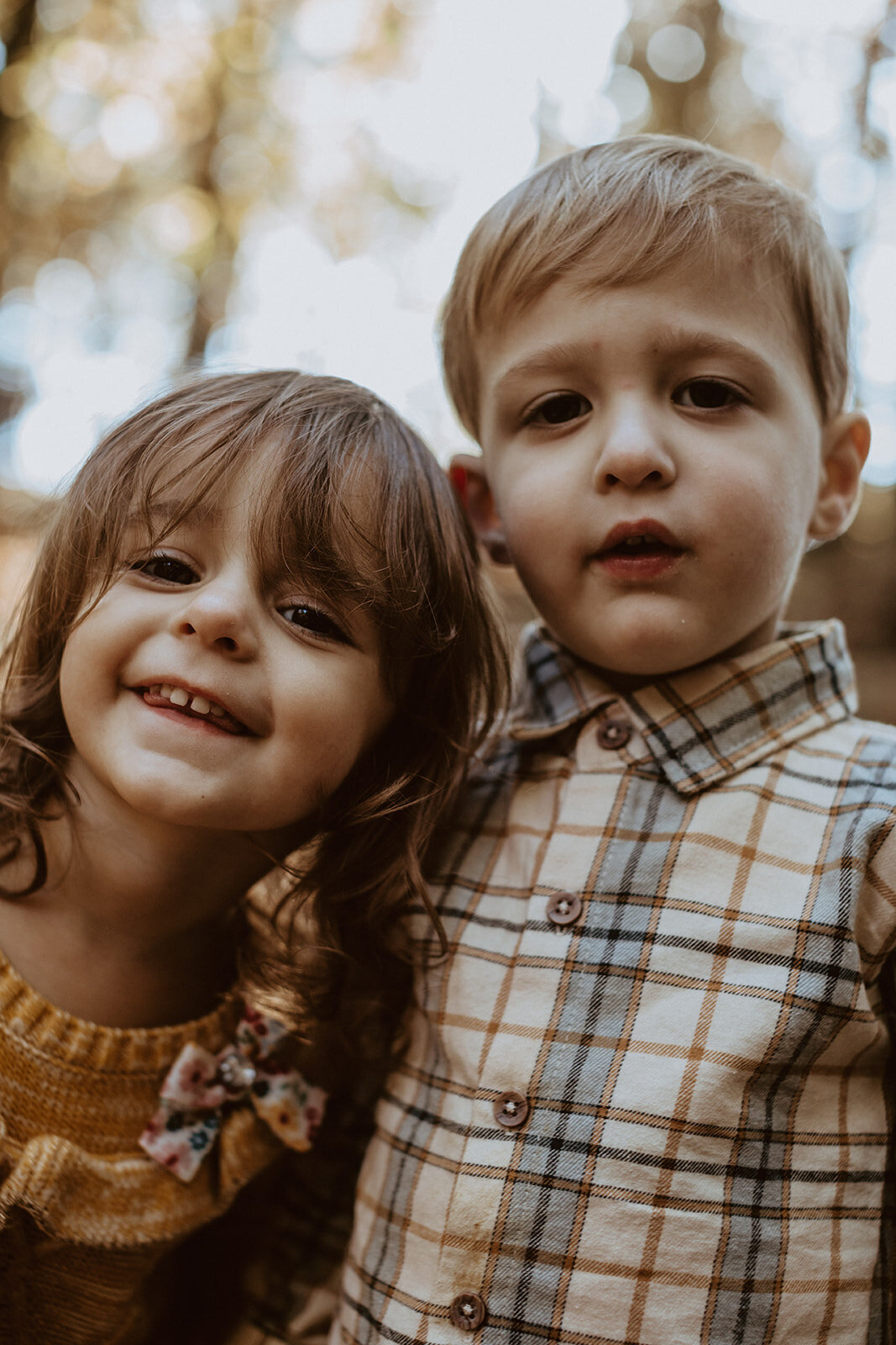 4 year old twins make a silly face at the camera 