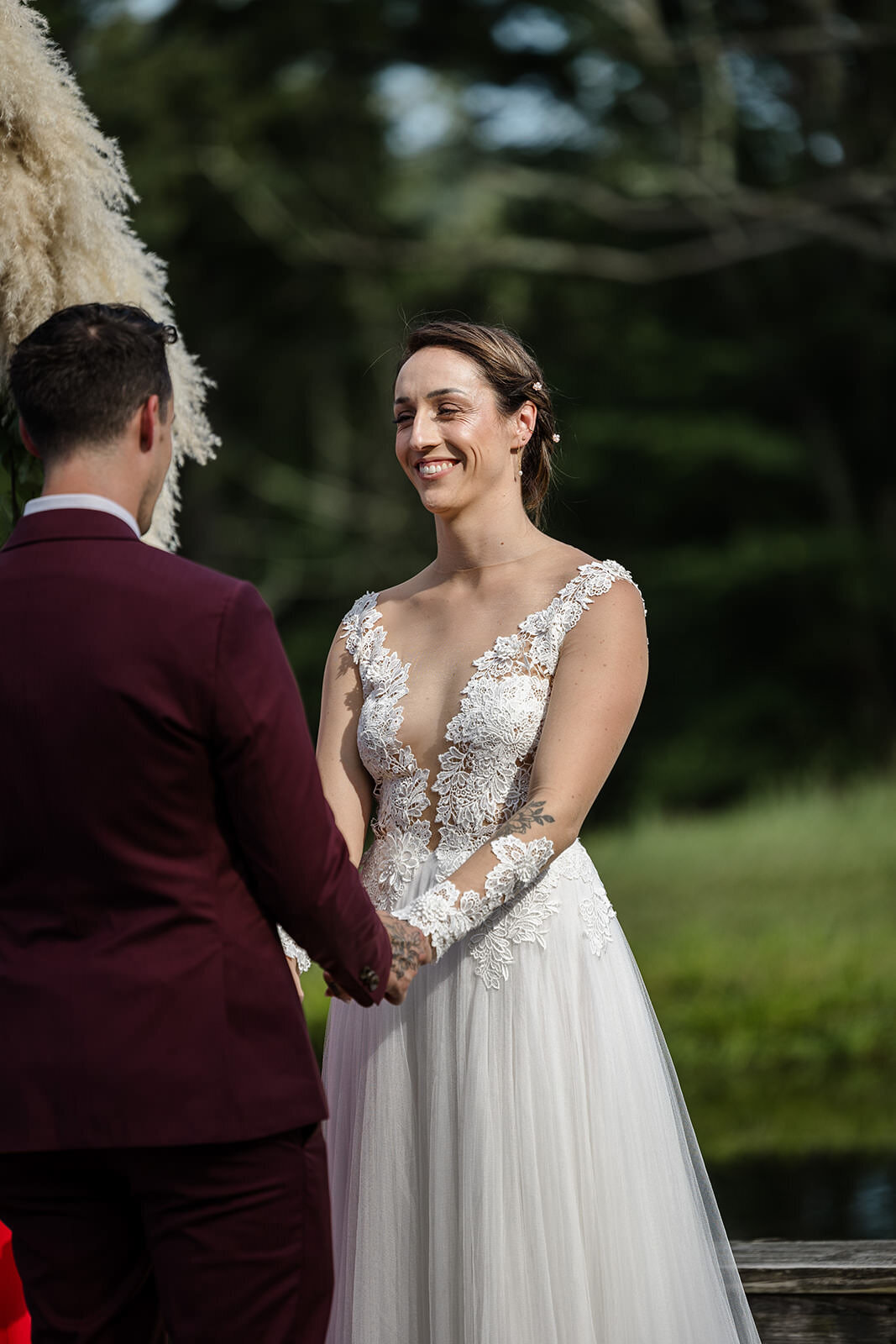A couple holding hands during their wedding ceremony
