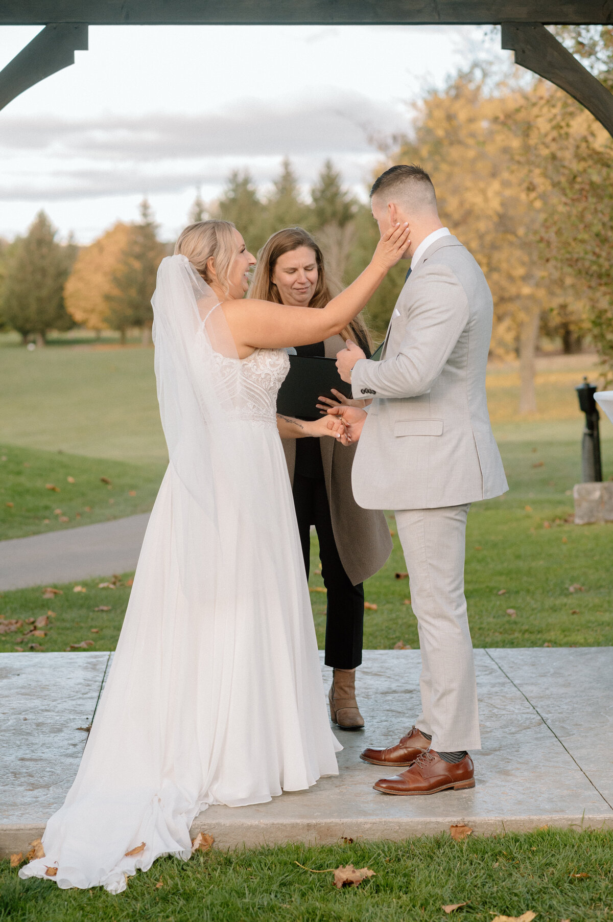 bride wipes groom's tears away