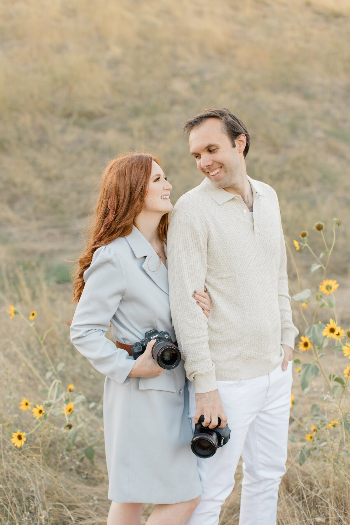 landscape shot of husband and wife by the water at sunset in boise idaho