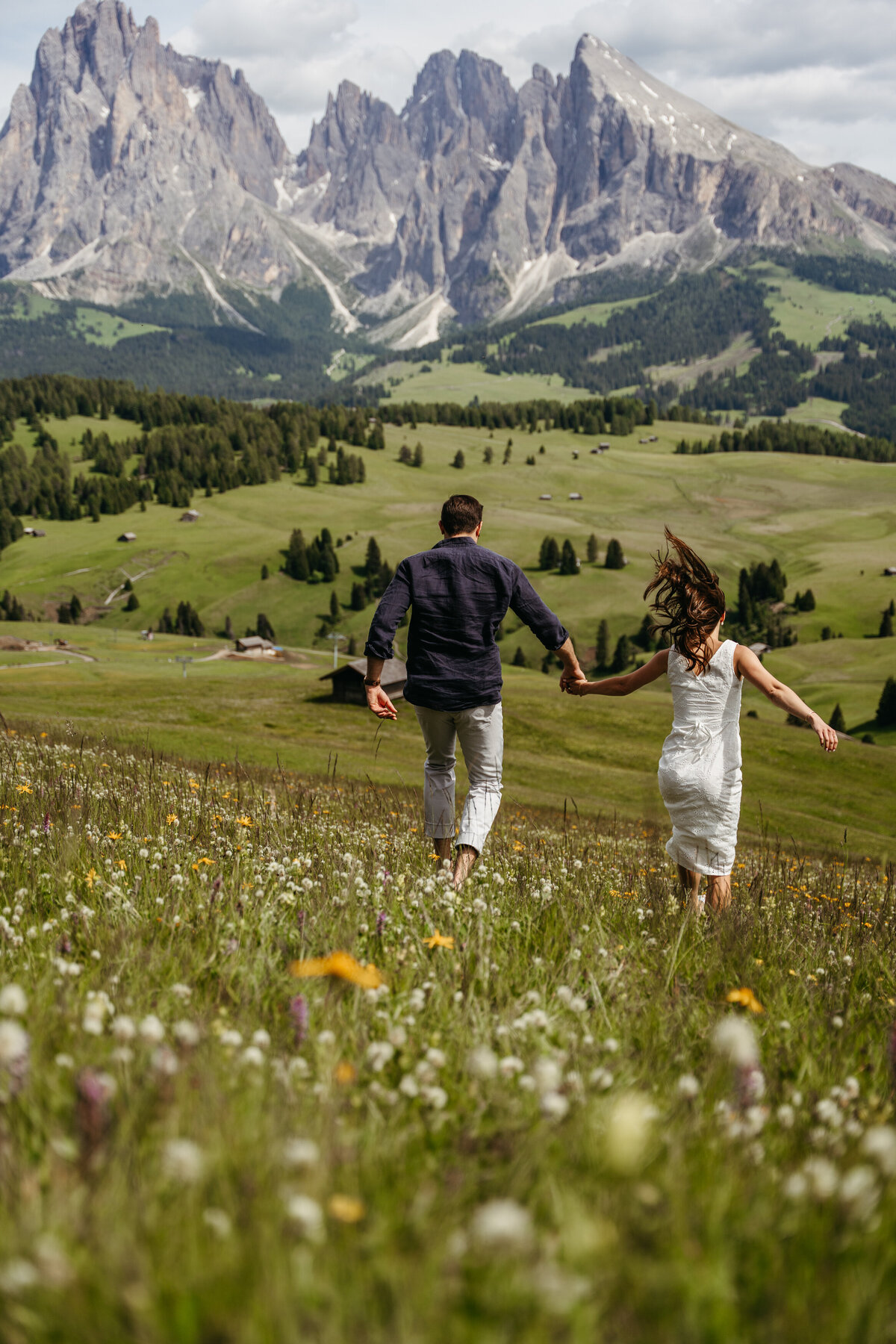 sweet couple intimate Alpe di Siusi mountain meadow view