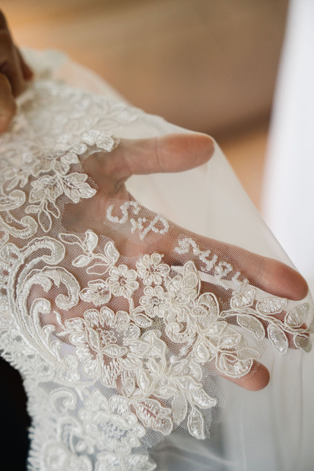 Bride's wedding dress sleeve with custom embroidery