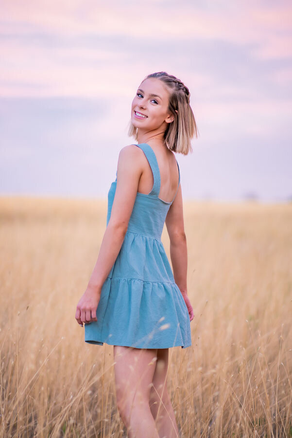 colorado-girl-high-school-senior-posing-in-field-cherry-creek.jpg