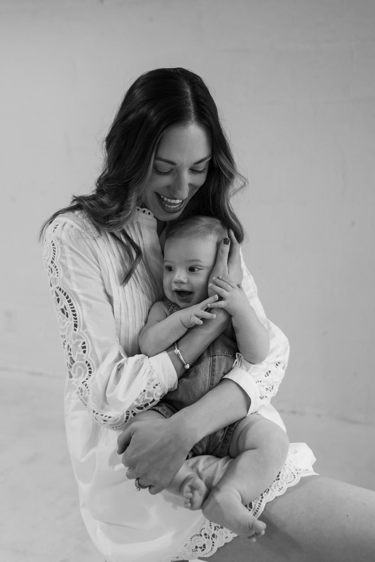 a mom holding her baby