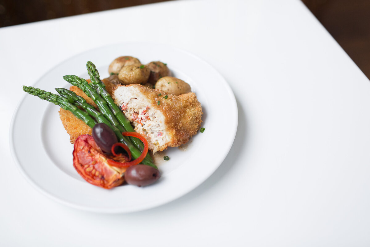 sundried tomato stuffed chicken with asparagus and fingerling potatoes served sit-down at Willowbrook wedding venue in Pittsburgh