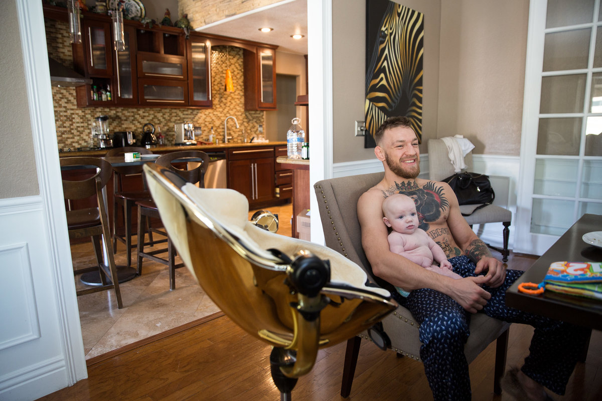 Conor McGregor holding his baby son