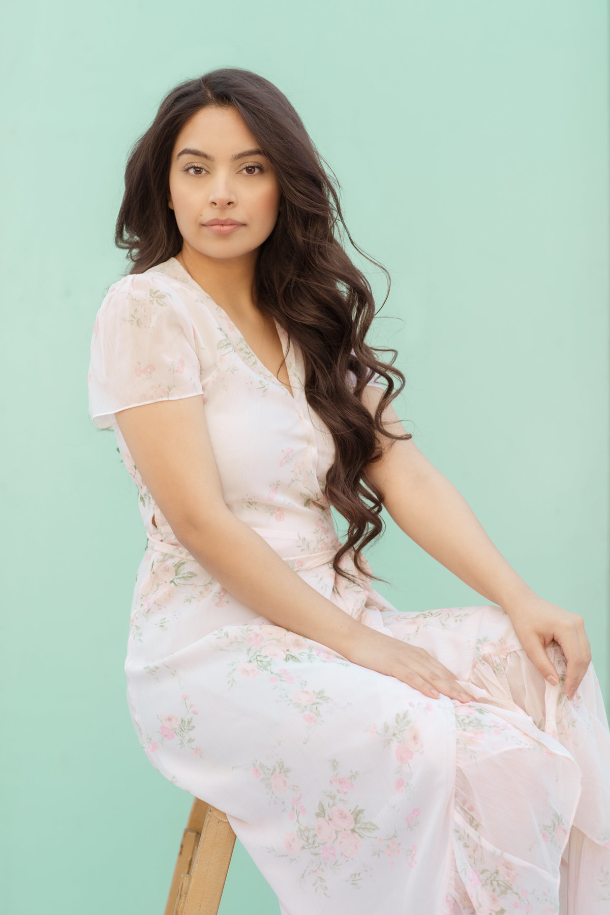 Portrait Photo Of Young Woman In White Dress Holding Her Knee Los Angeles
