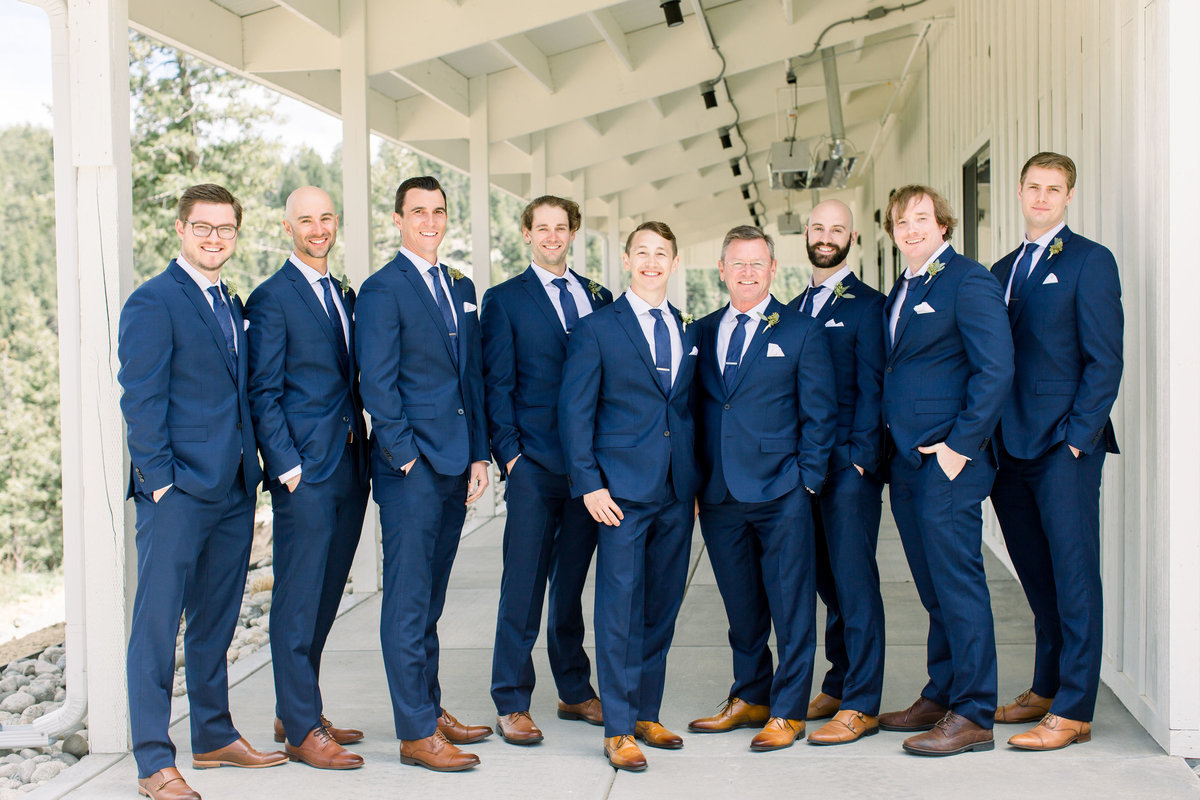 Group photo of groomsmen in blue suits