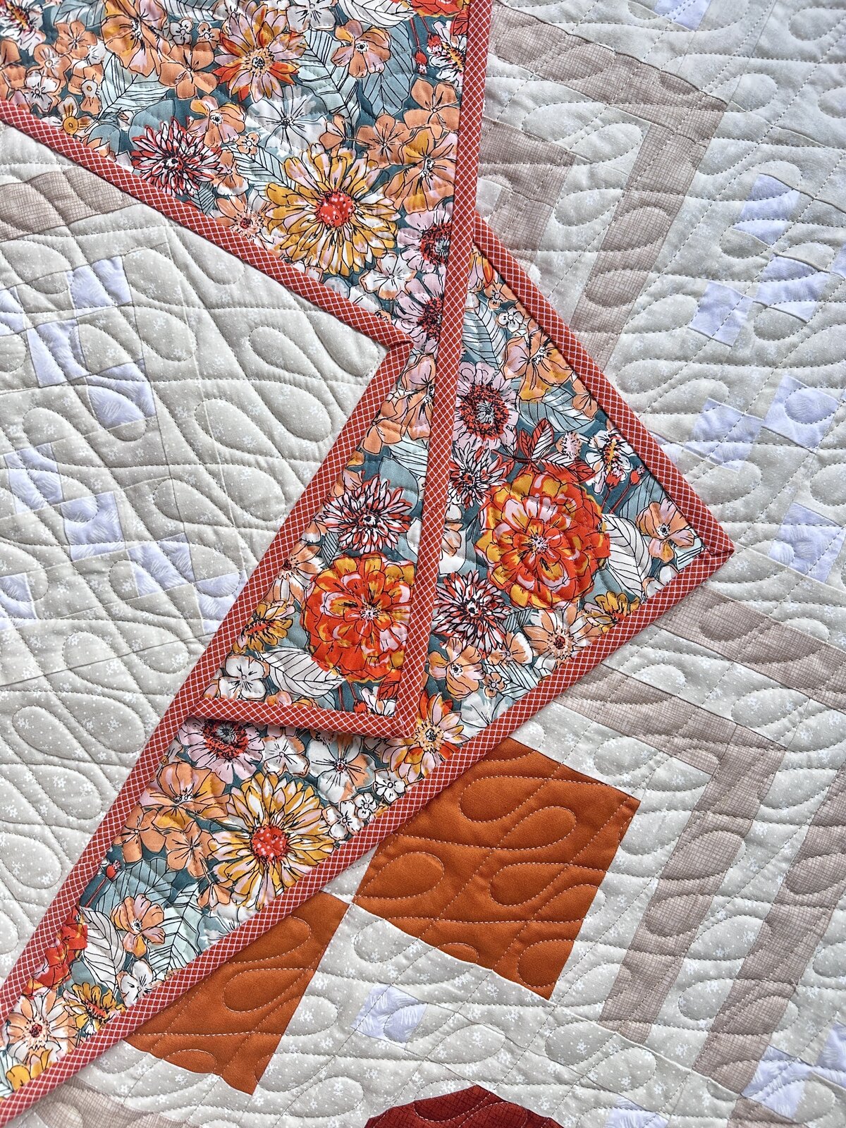 This orange and tan quilt features the crazy 8's quilting design