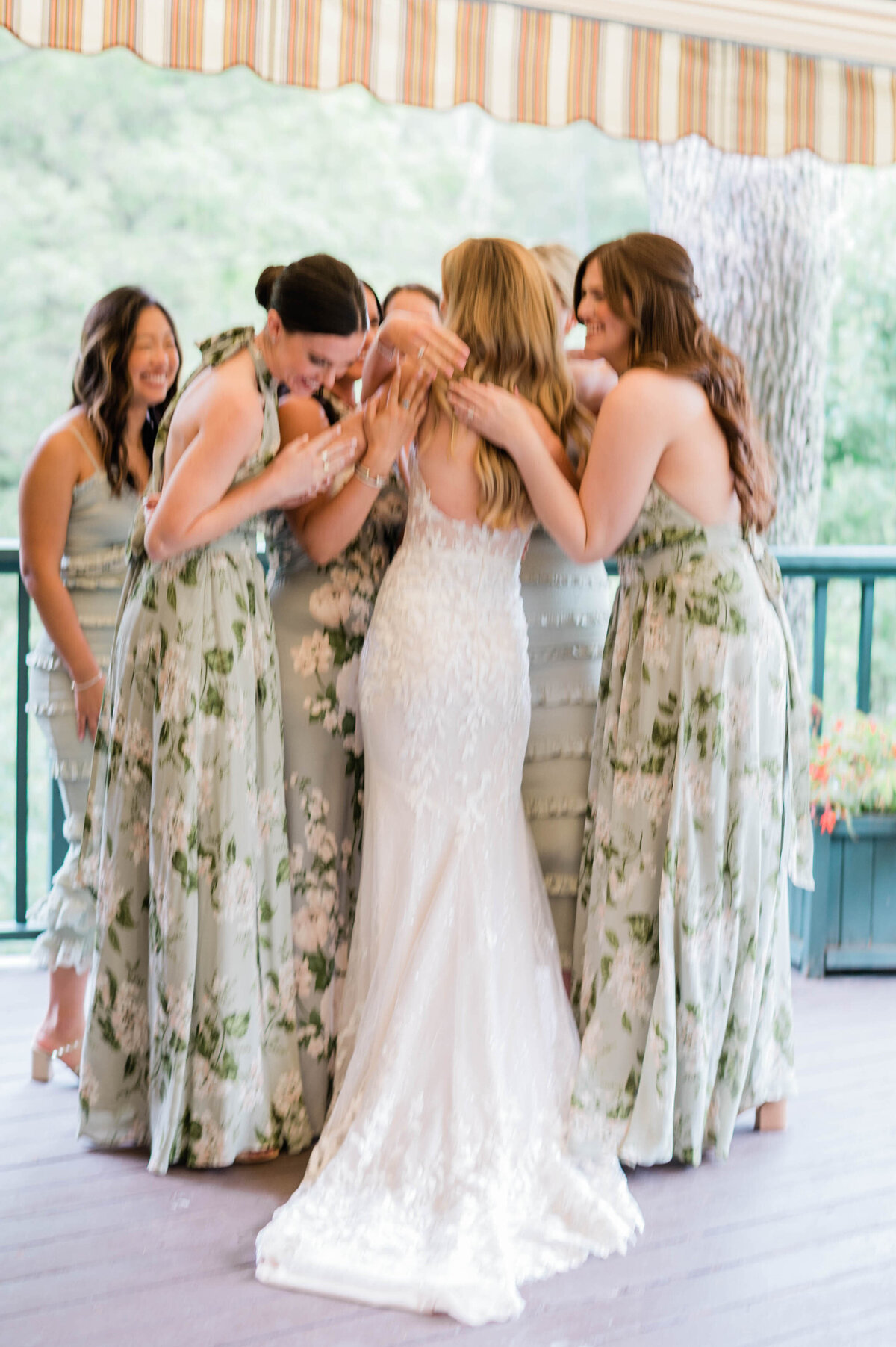 Bride hugs all six bridesmaids