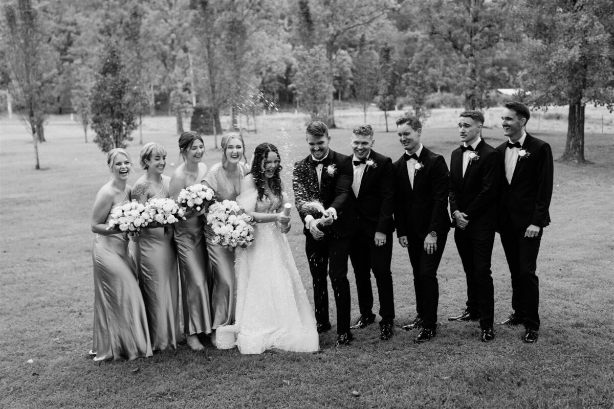 Capture cherished moments with friends in a joyful wedding photoshoot.