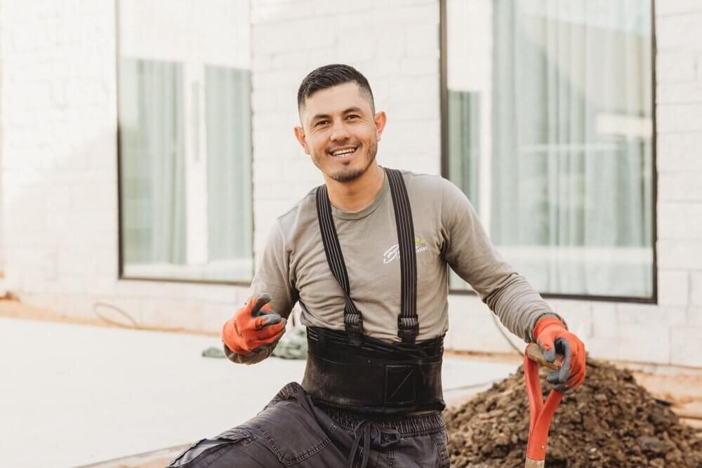 landscape-crew-member-smiling-on-jobsite-thumbnail