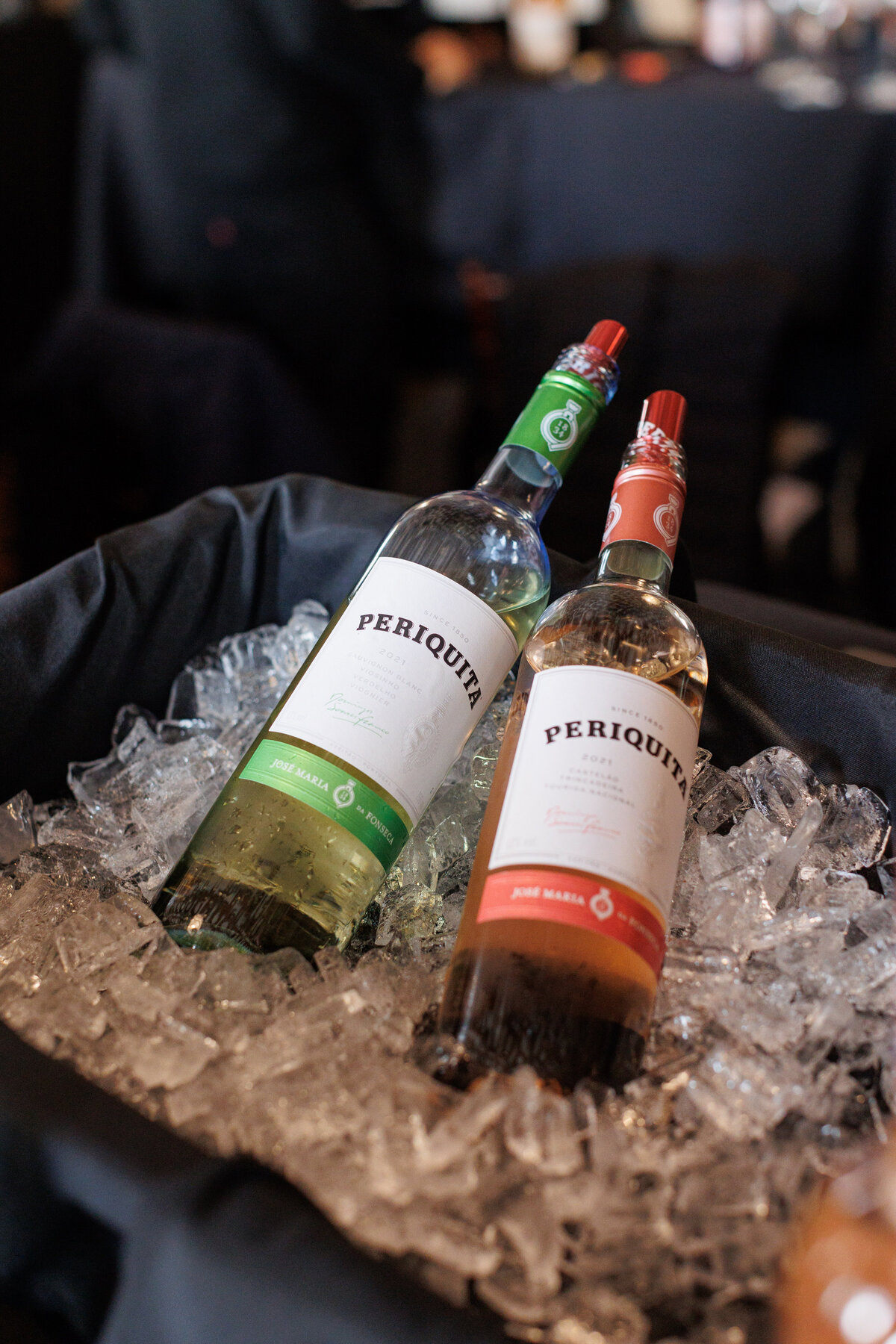 two bottles of Periquita wine over an ice bucket