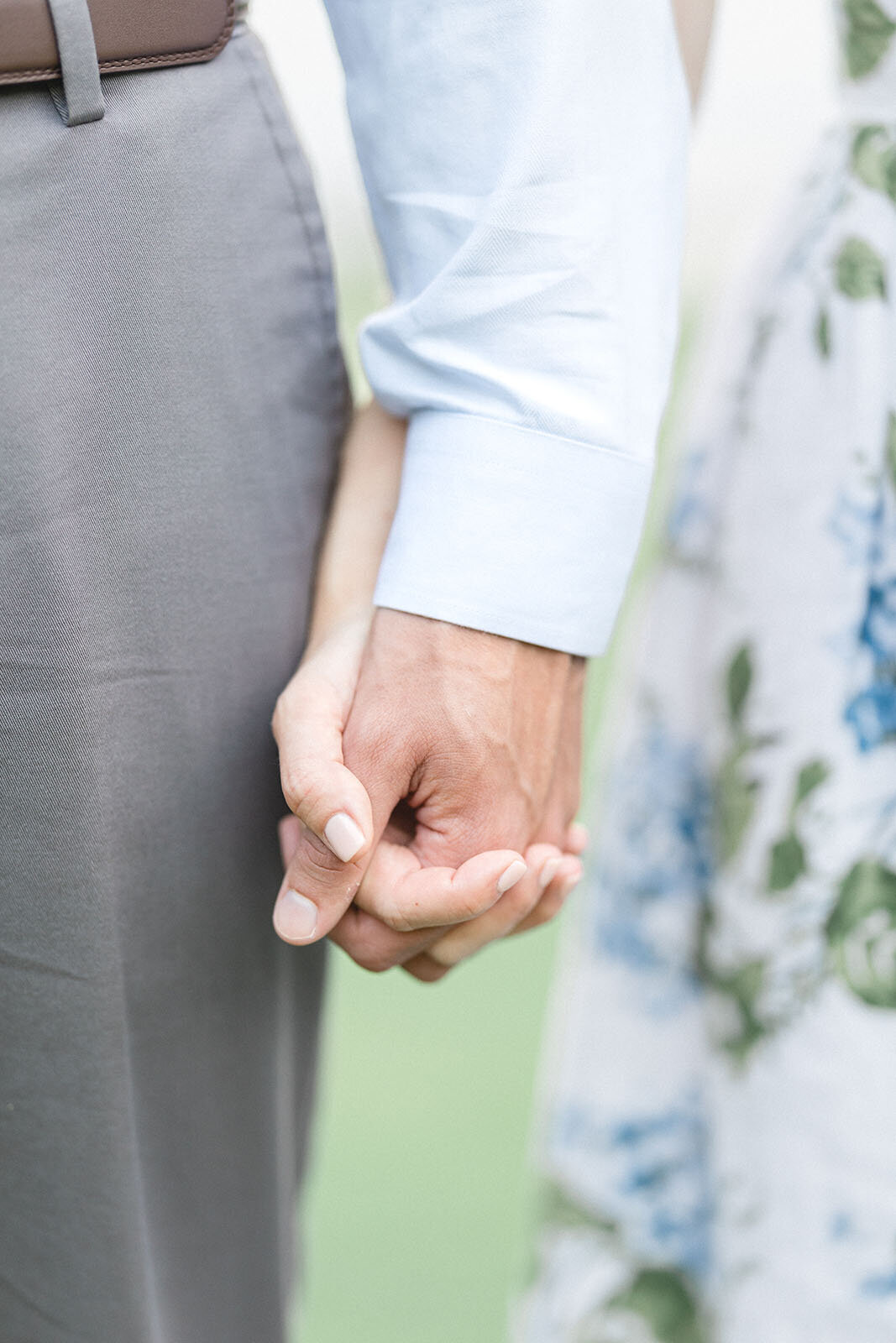 engaged_couple_holding_hands