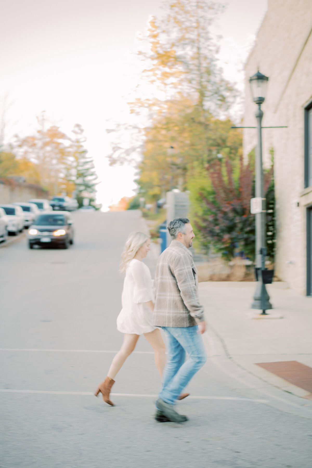 Walking down Elora Mill street holding hands, loving each oher walking