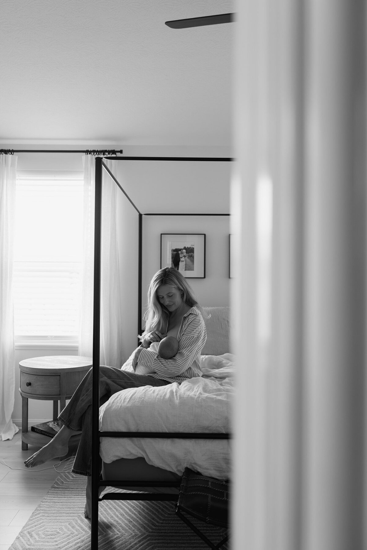 Quiet moment of mother breastfeeding during newborn session