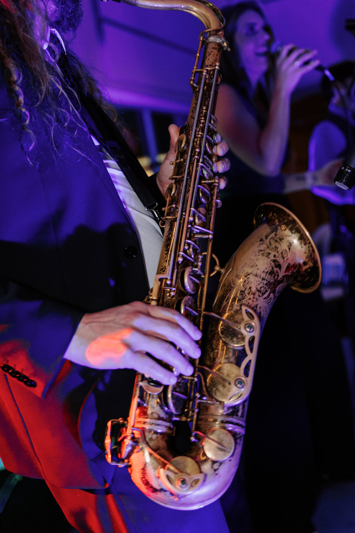 A person playing sax at a wedding reception
