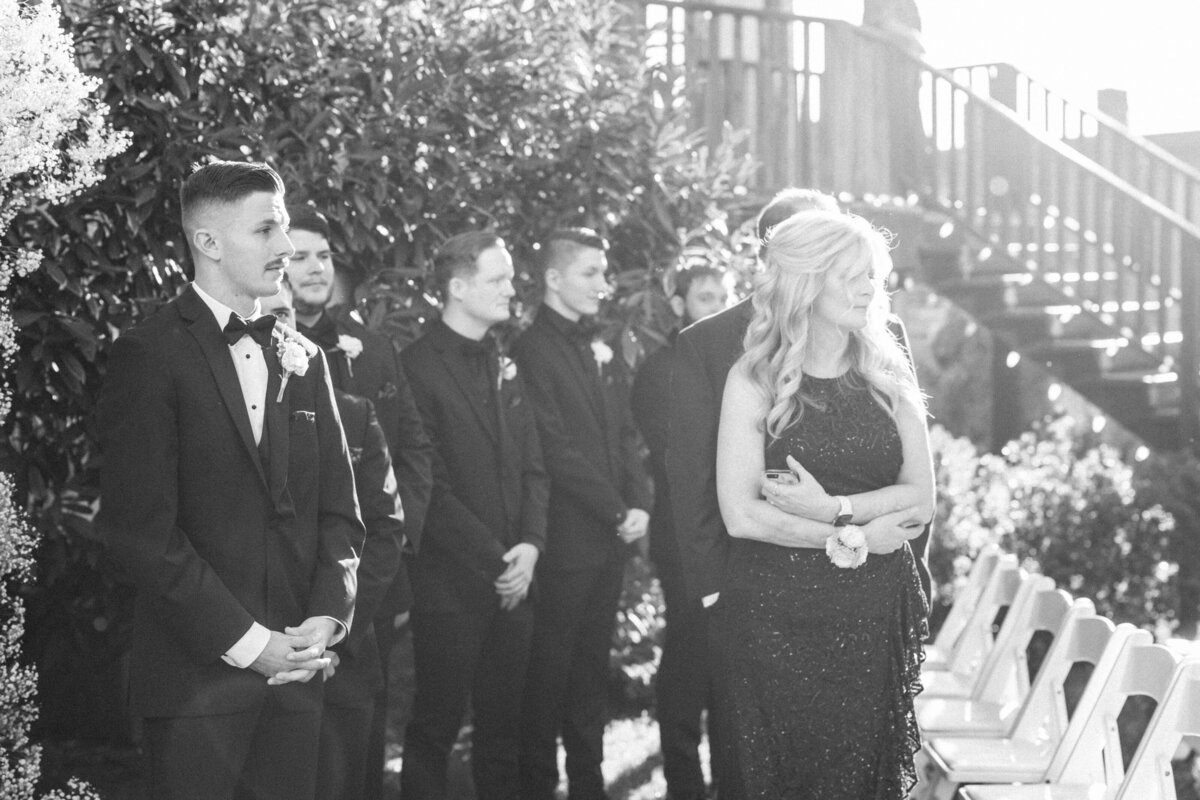 groom-watching-bride-come-down-aisle