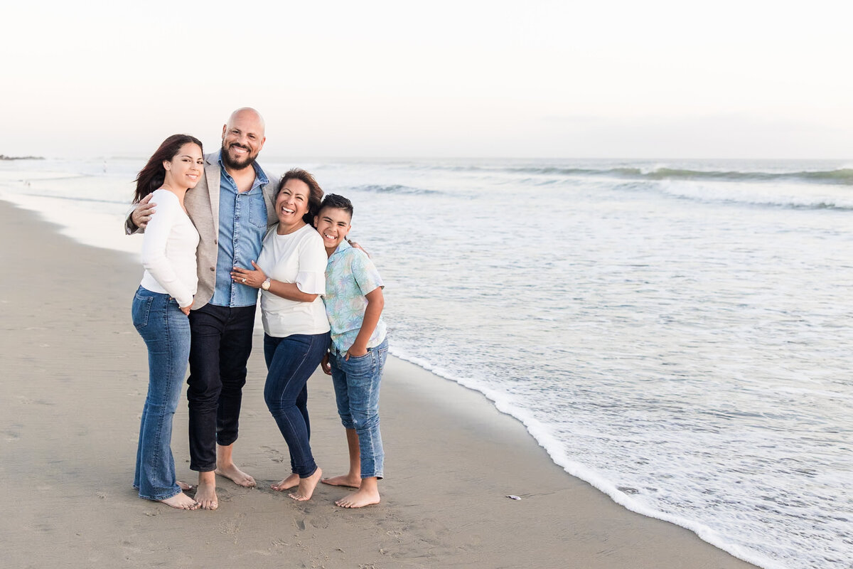 family-of-gour-laughing-on-coronado-beach-san-diego