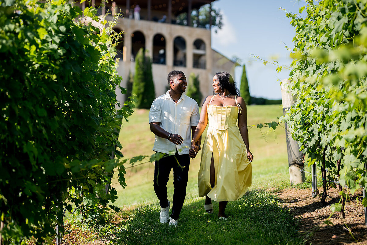 Montaluce-winery-couple-walking-through-vineyard