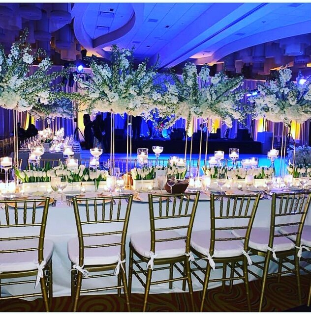 16FT tablescape decor using bridge centerpieces filled with tulips, orchids and roses