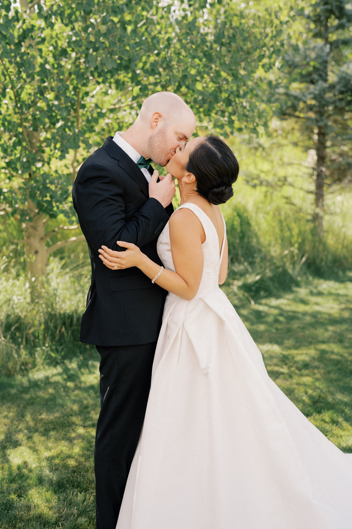 Bride and groom kiss at Montana wedding