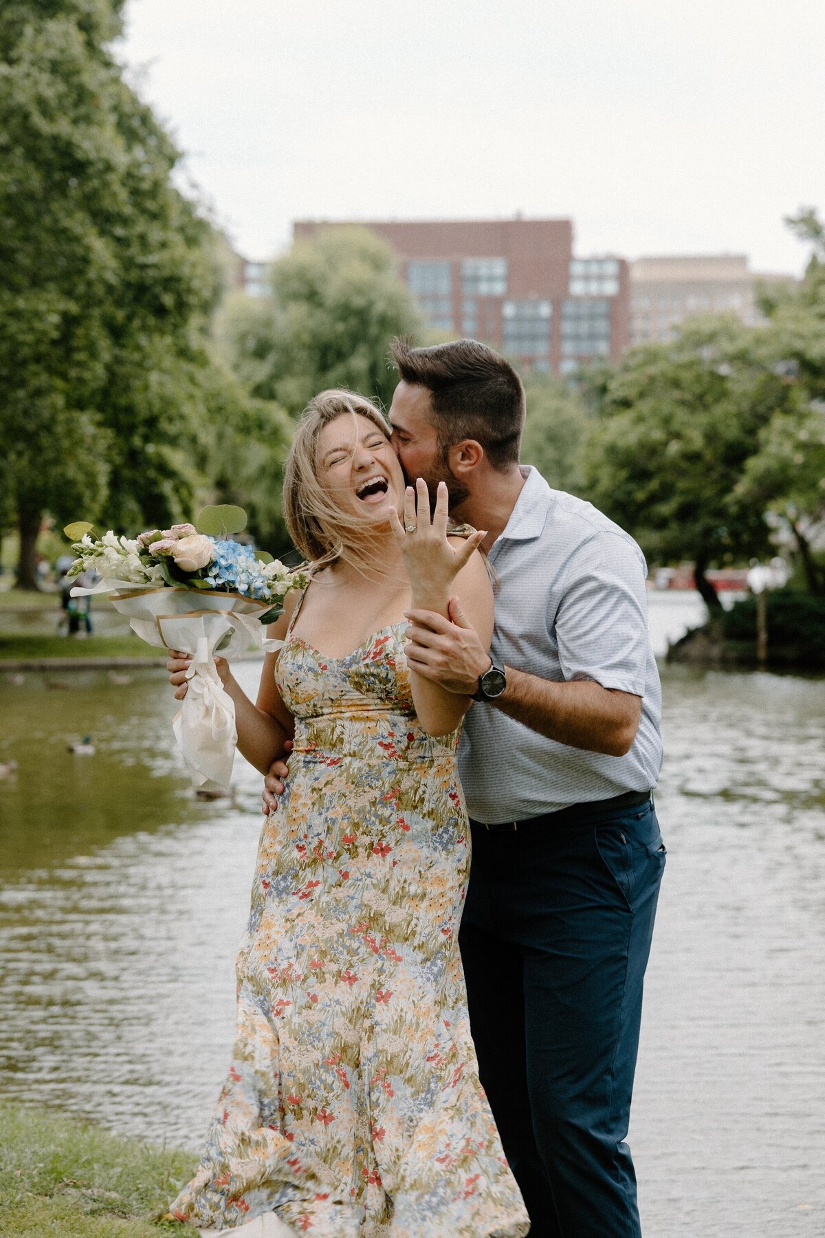 engaged couple showing ring