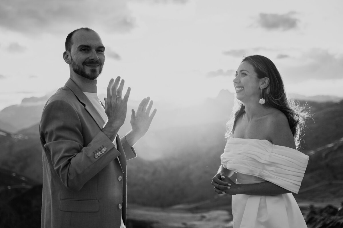 romantic couple wearing wedding ring with dramatic Dolomites backdrop
