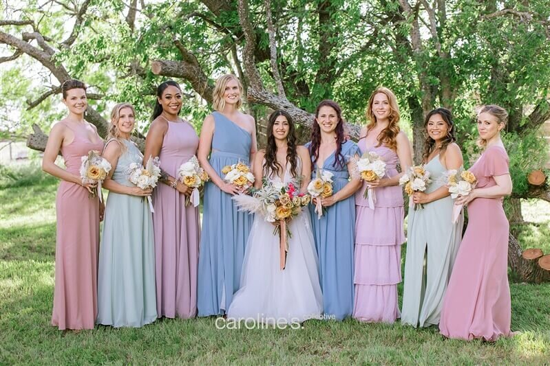 Wedding party hair styled for a romantic outdoor ceremony in San Antonio. Mistique Makeup offers hair and makeup services for bridesmaids and the entire bridal party.