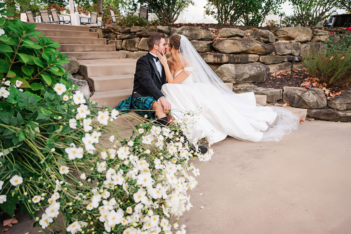wedding flowers with married couple portrait