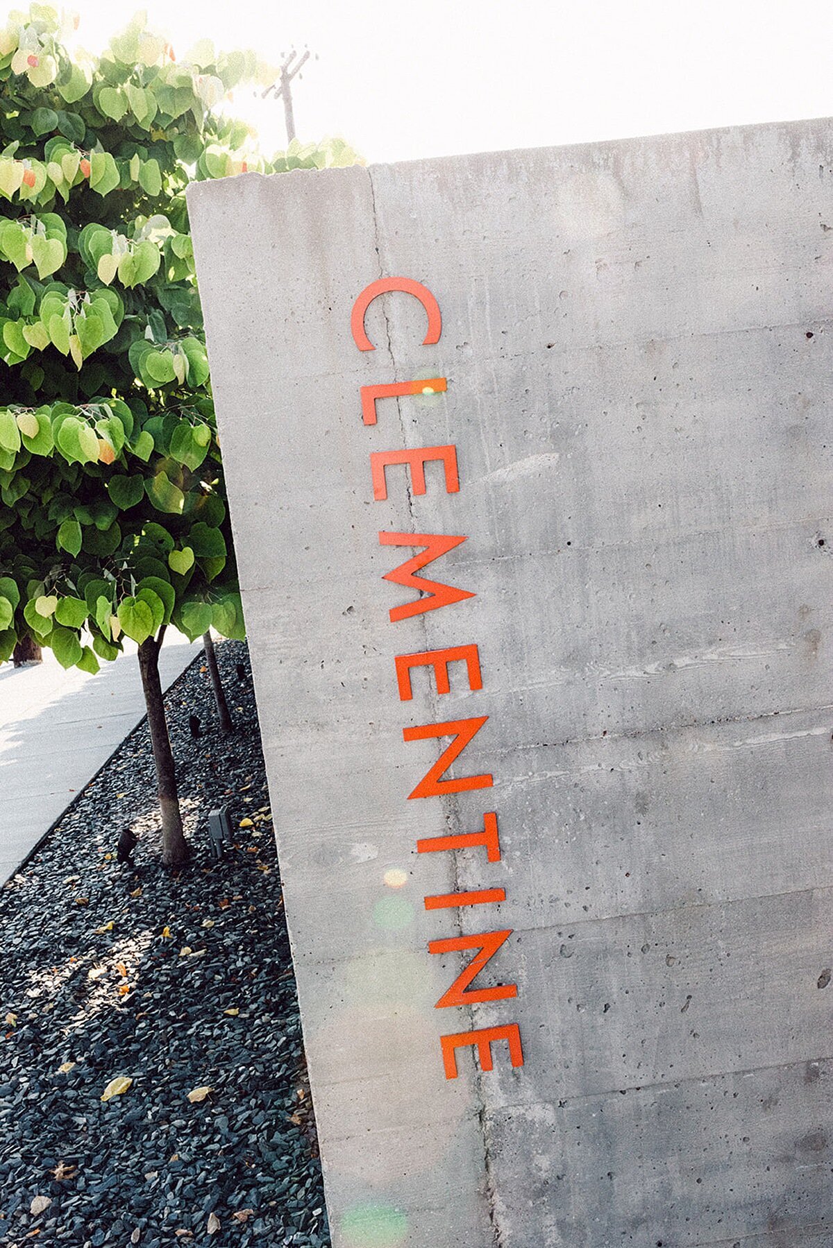 Gray concrete entryway to Clementine Hall in Nashville Tennessee with the word Clementine written in orange.