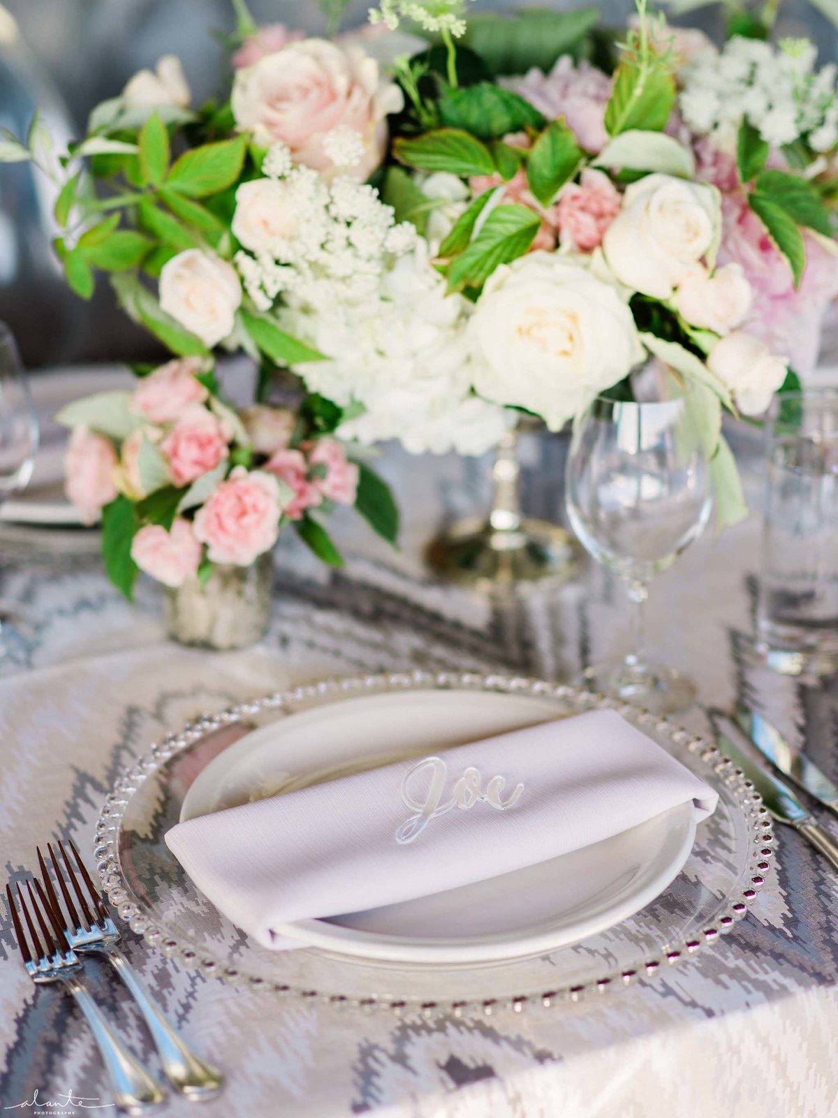 Wonderful details of custom lucite name cards and ikat linens  at this wedding reception.