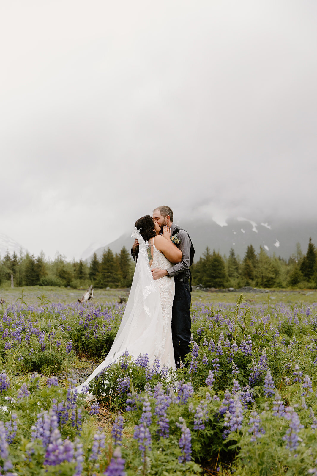 Elopement couple shares first kiss after saying vows.