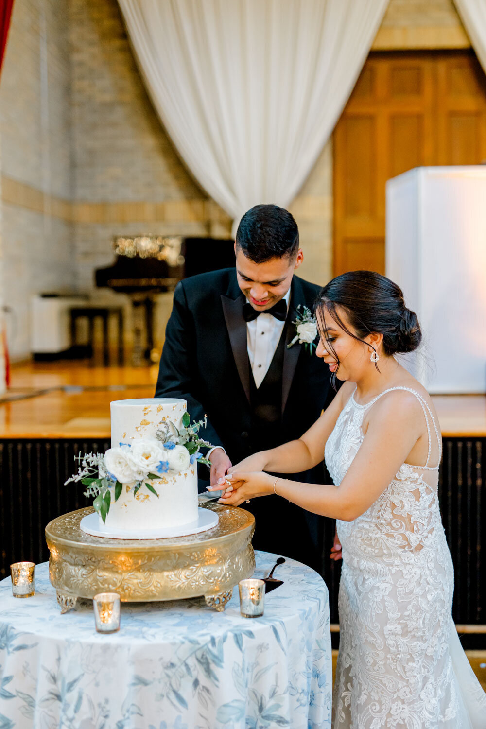 Couple cutting their wedding cake together