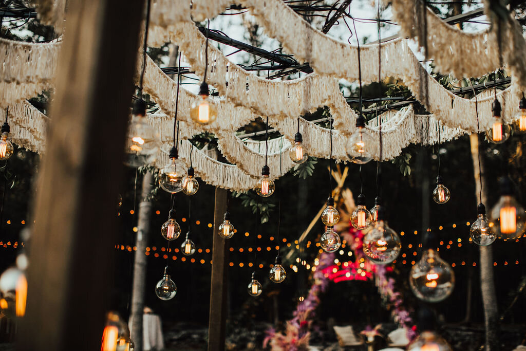First dance under macrame canopy and exposed bulb string lights