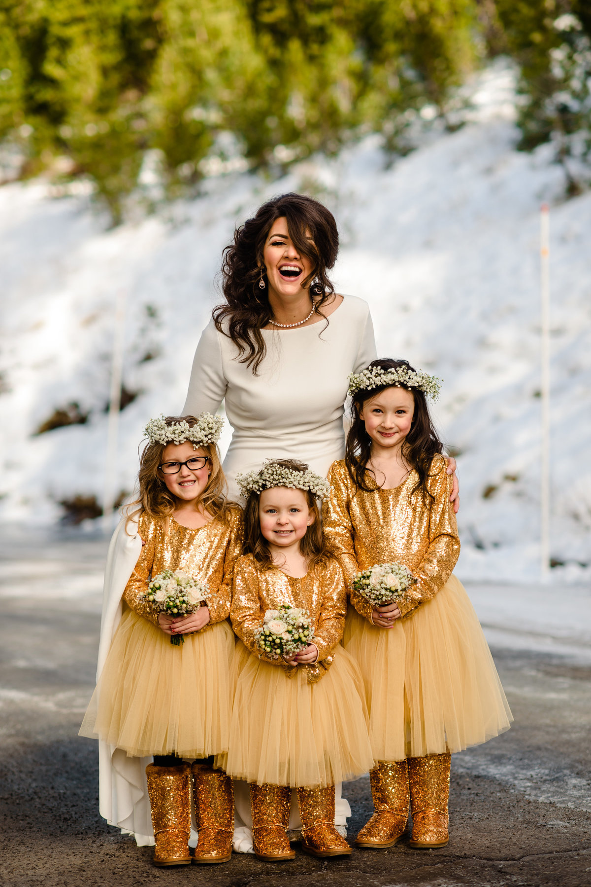 Lake Tahoe Wedding Planners bride in snow 3 flower girls in gold sequins, winter wedding at venue The Resort at Squaw Creek, Lake Tahoe, Joy of Life Events image by Charleston Churchill