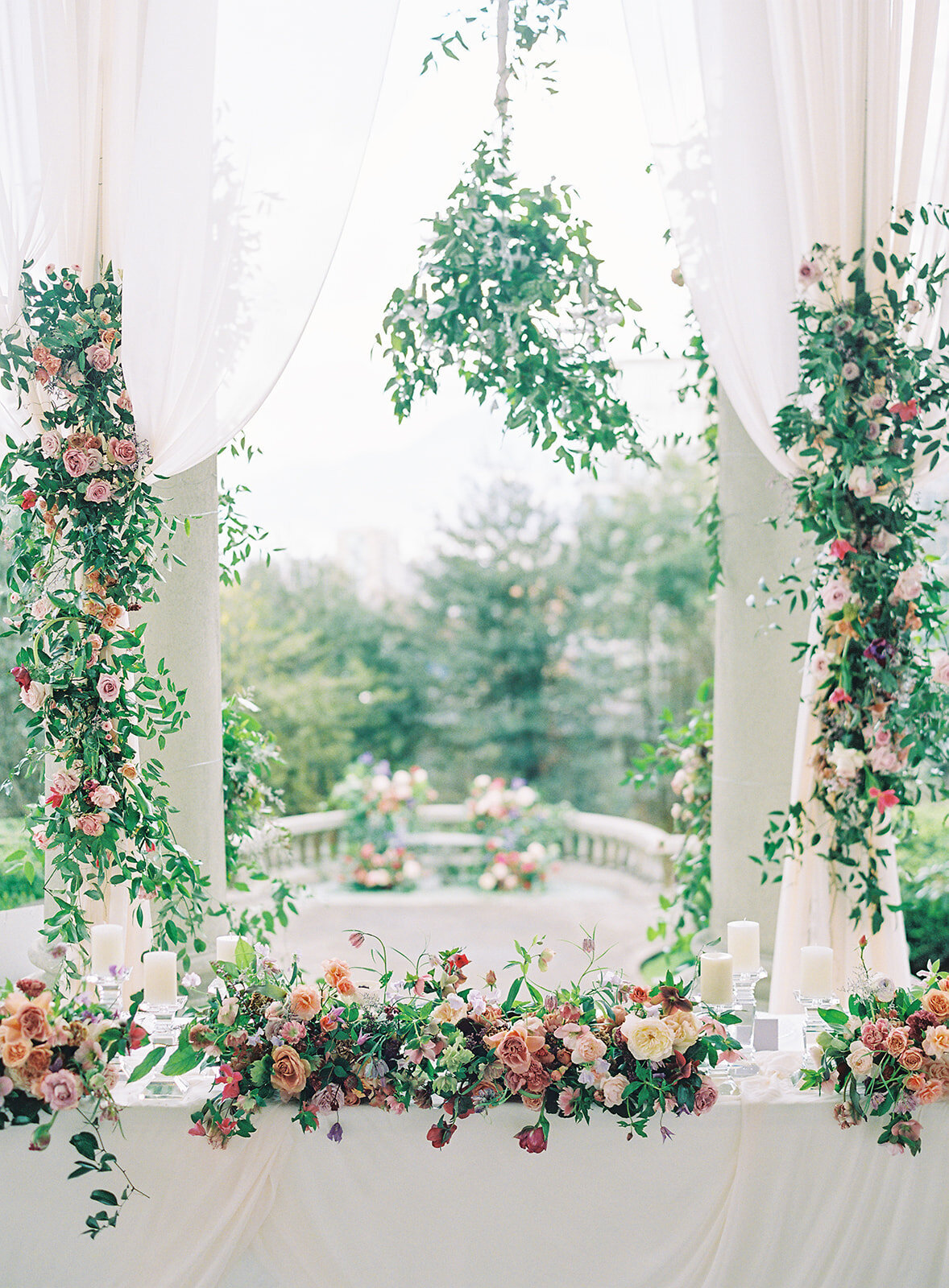 draping and hanging flowers at reception