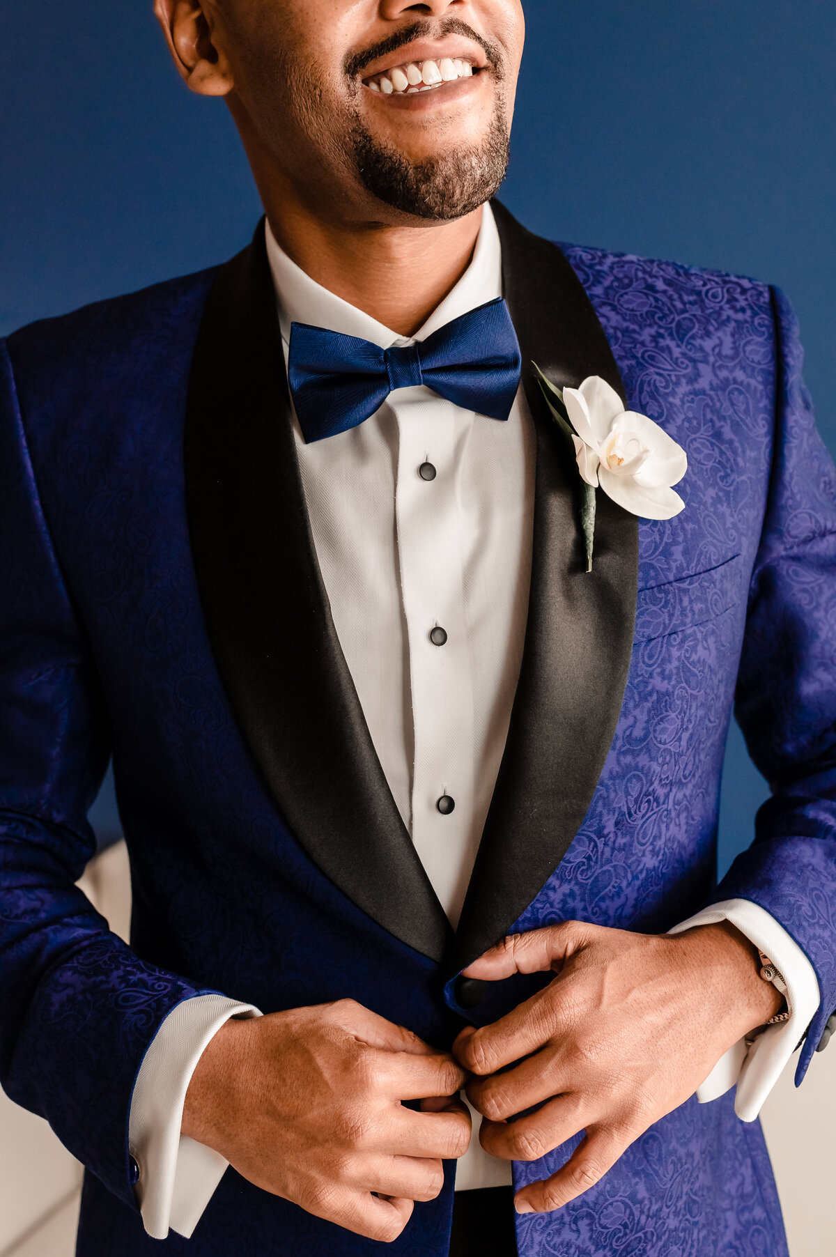 Handsome black Groom in blue custom tux by lyndah wells photography