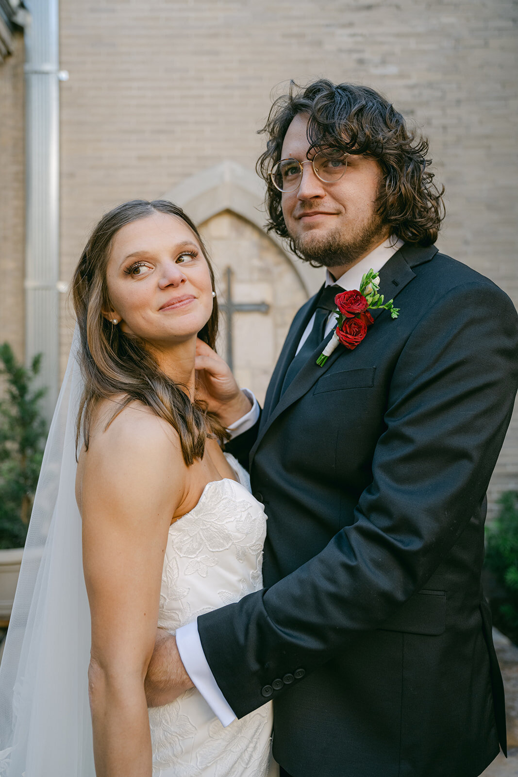 Cinematic image of bride and groom in elegant wedding attire with natural light in San Antonio