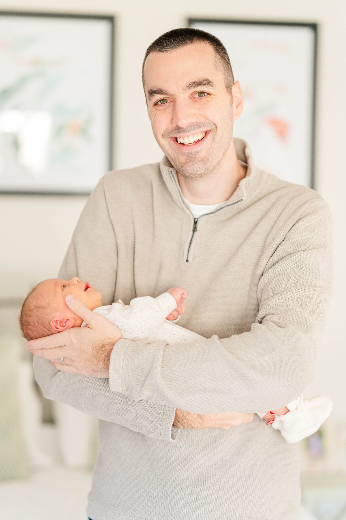 Newborn in dad's arms taken in Sutton, MA 