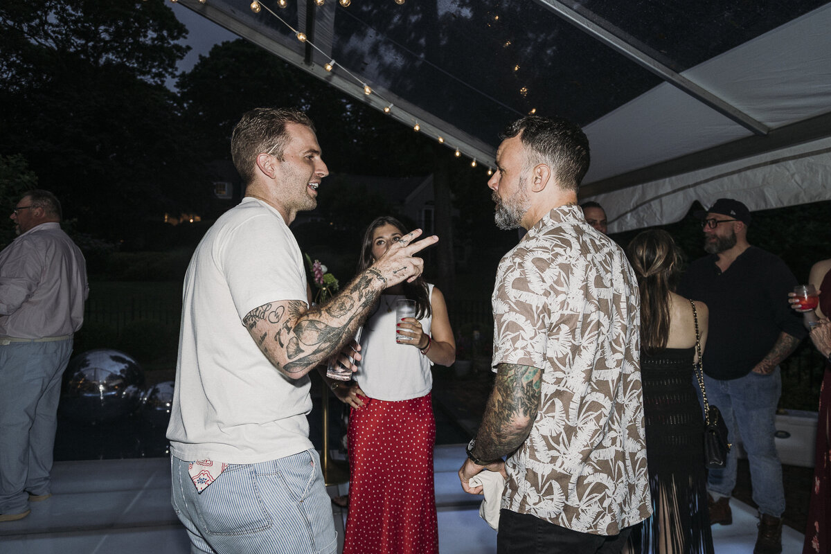 Photo of guests in private backyard party by Mira Park Photography NY based wedding photographer