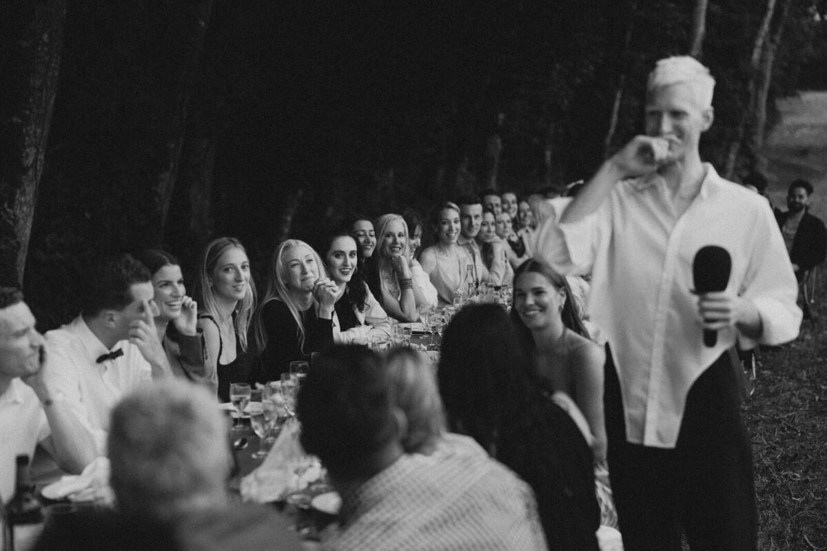 Guest giving a tearful speech to the Bride and Groom at their rehearsal dinner in the countryside of Burgundy France, captured by Andrea-Marie Photography