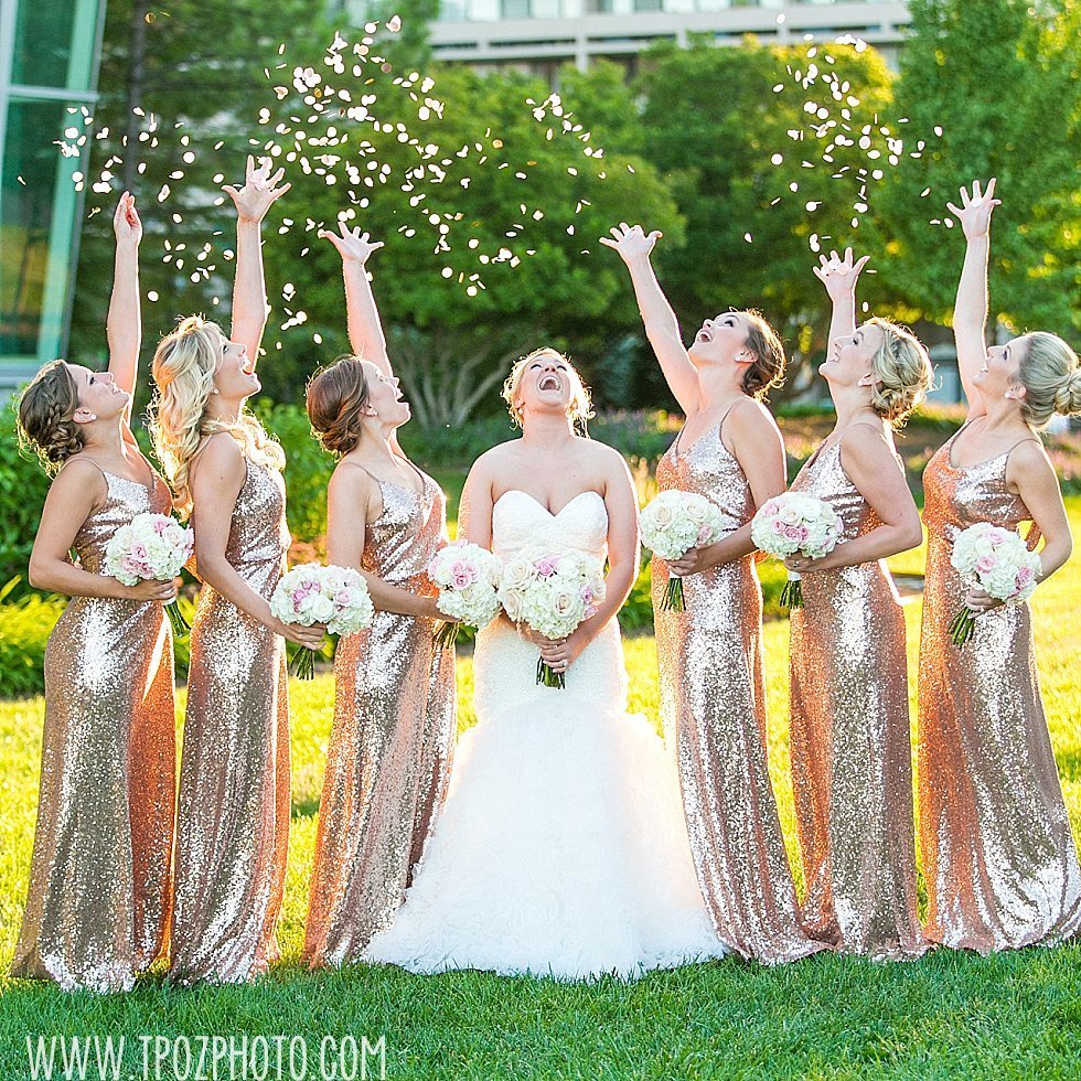 Bridesmaids tossing confetti around